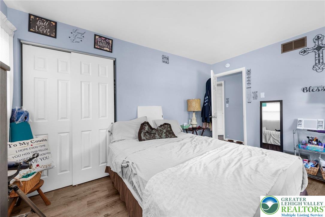 935 Marion Street Bethlehem, PA 18017 - Photo 14 of 20 a bedroom with a bed and a flat tv screen