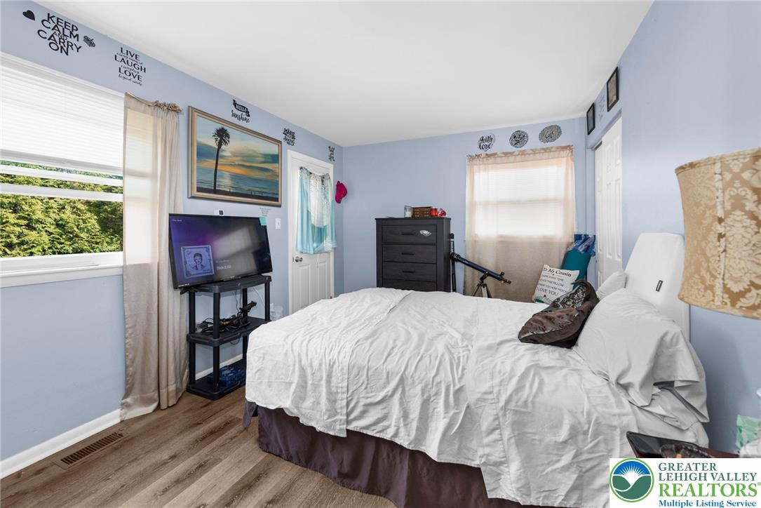 935 Marion Street Bethlehem, PA 18017 - Photo 17 of 20 a bedroom with a bed table closet and a window