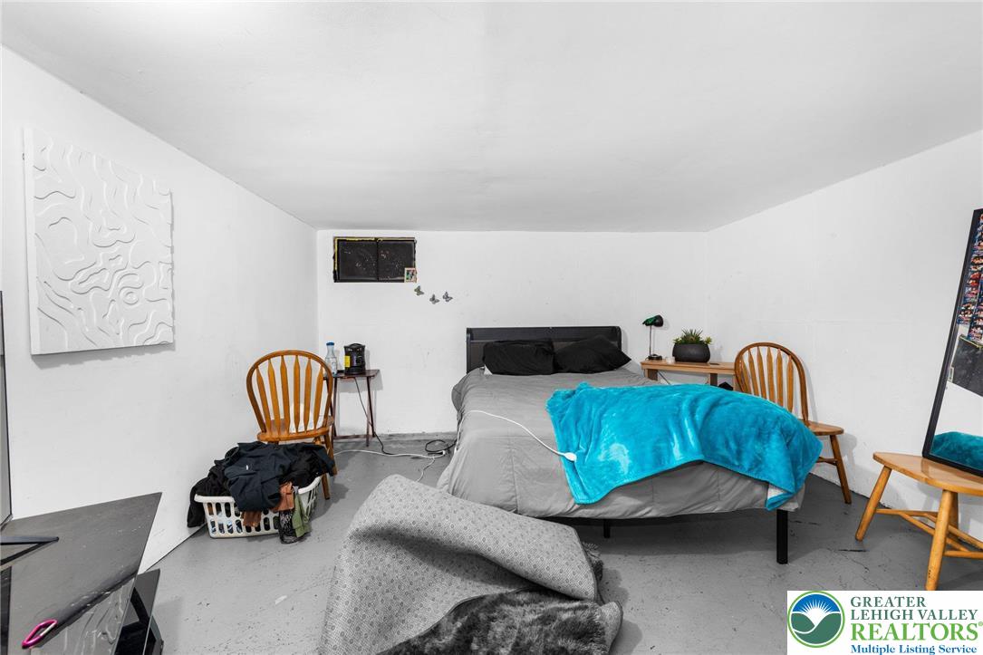 935 Marion Street Bethlehem, PA 18017 - Photo 18 of 20 a living room with furniture and a chair