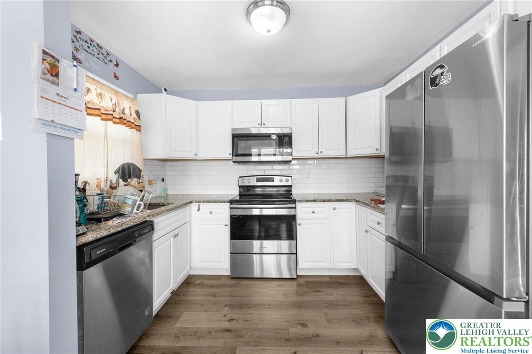 935 Marion Street Bethlehem, PA 18017 - Photo 5 of 20 a kitchen with a sink cabinets and stainless steel appliances
