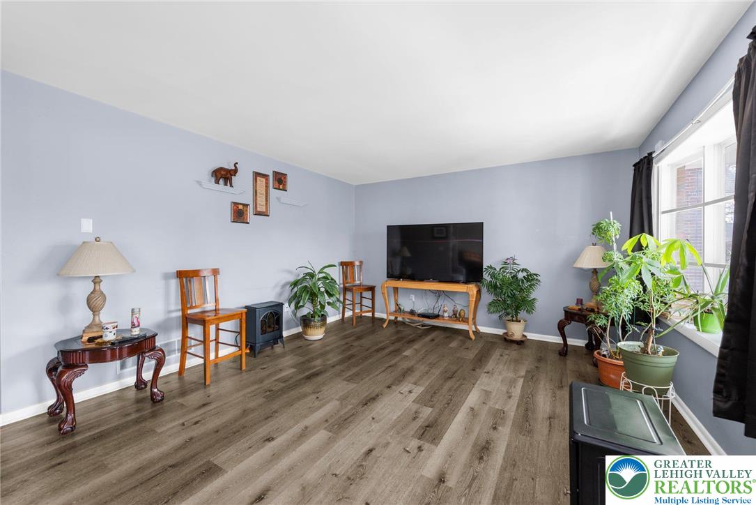 935 Marion Street Bethlehem, PA 18017 - Photo 8 of 20 a living room with furniture potted plant and a flat screen tv