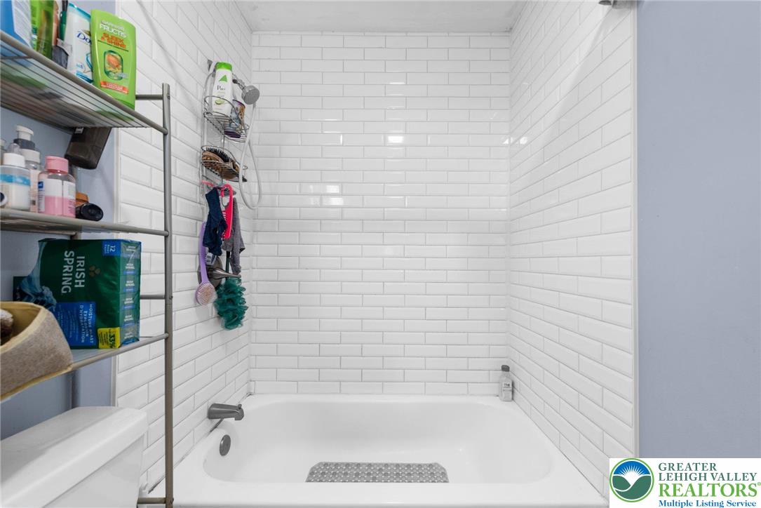 935 Marion Street Bethlehem, PA 18017 - Photo 10 of 20 a bathroom with a bathtub and a shower