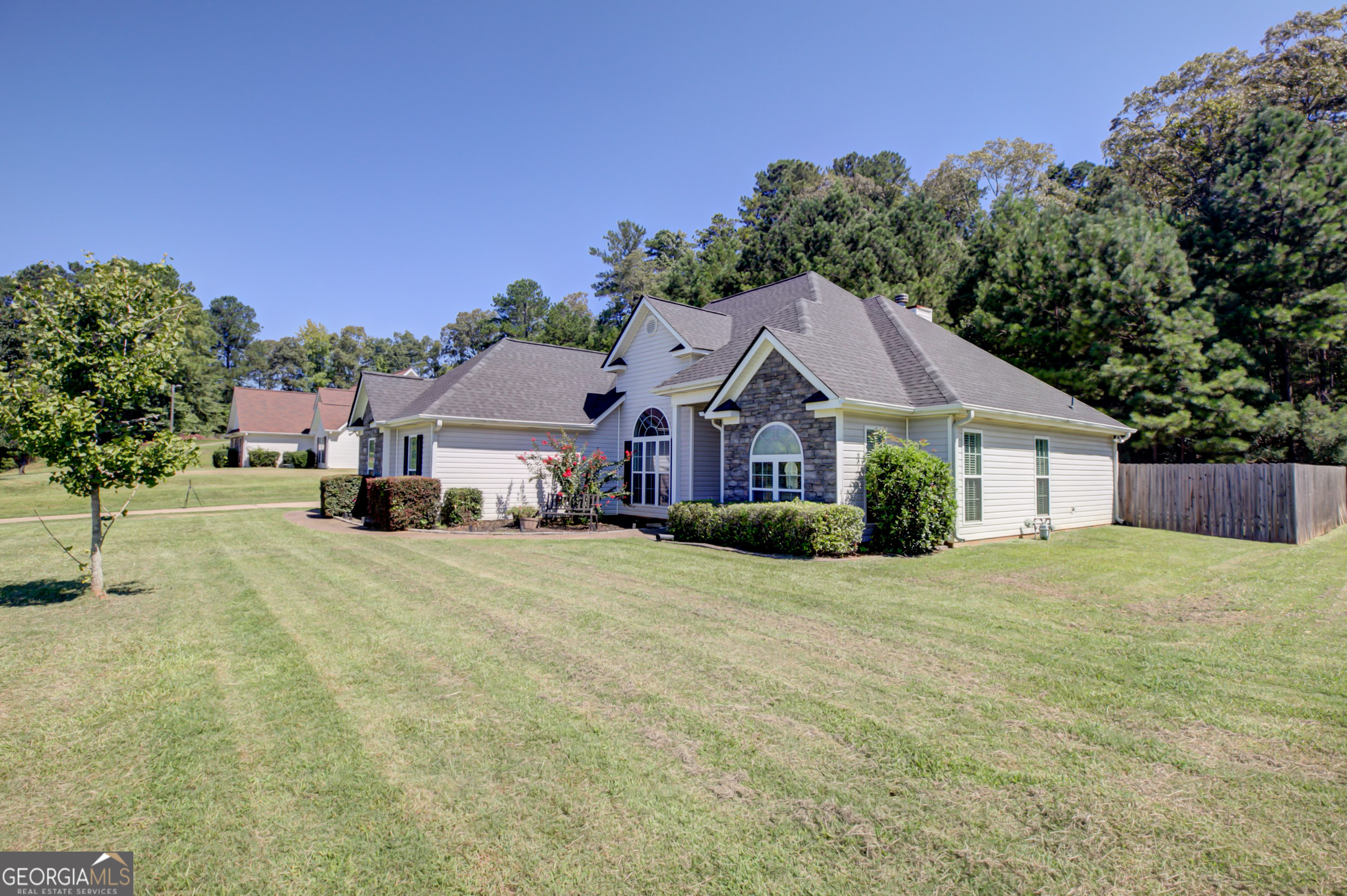 229 John Lovelace Road LaGrange, GA 30241 - Photo 45 of 59 a front view of a house with a yard and garage