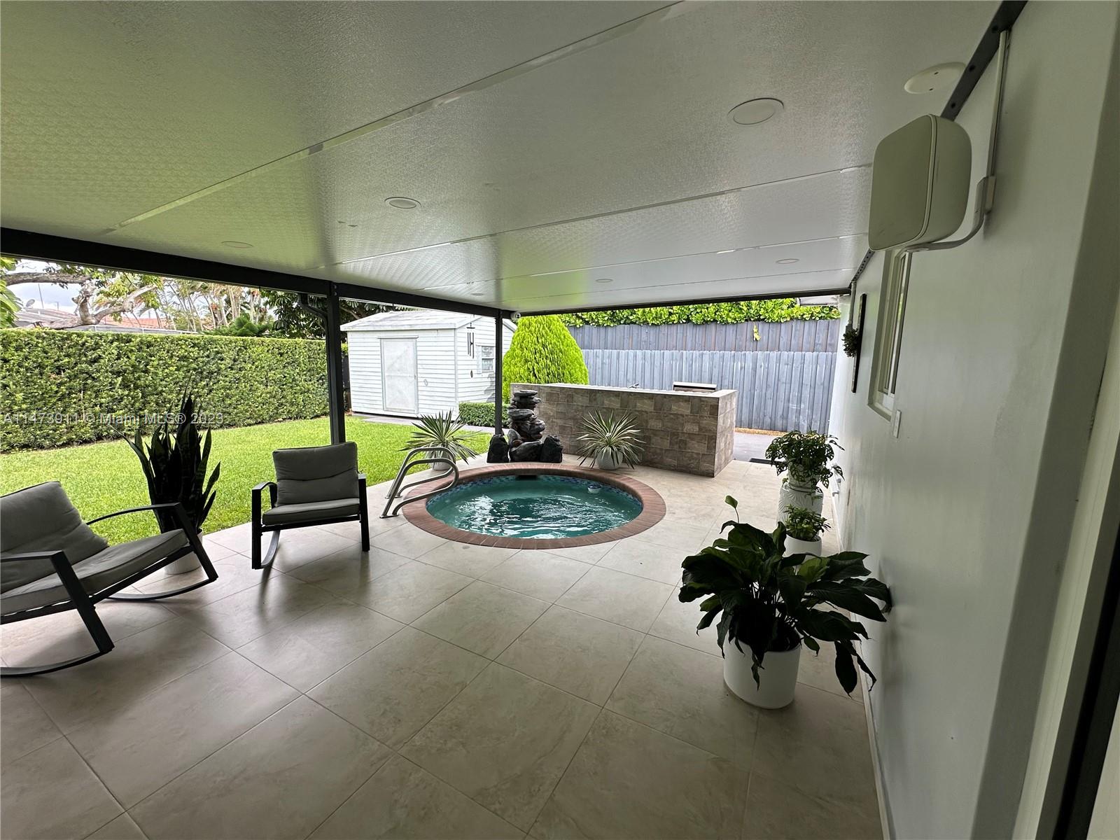 4610 Southwest 89th Place Miami, FL 33165 - Photo 12 of 52 a living room with furniture and a fireplace