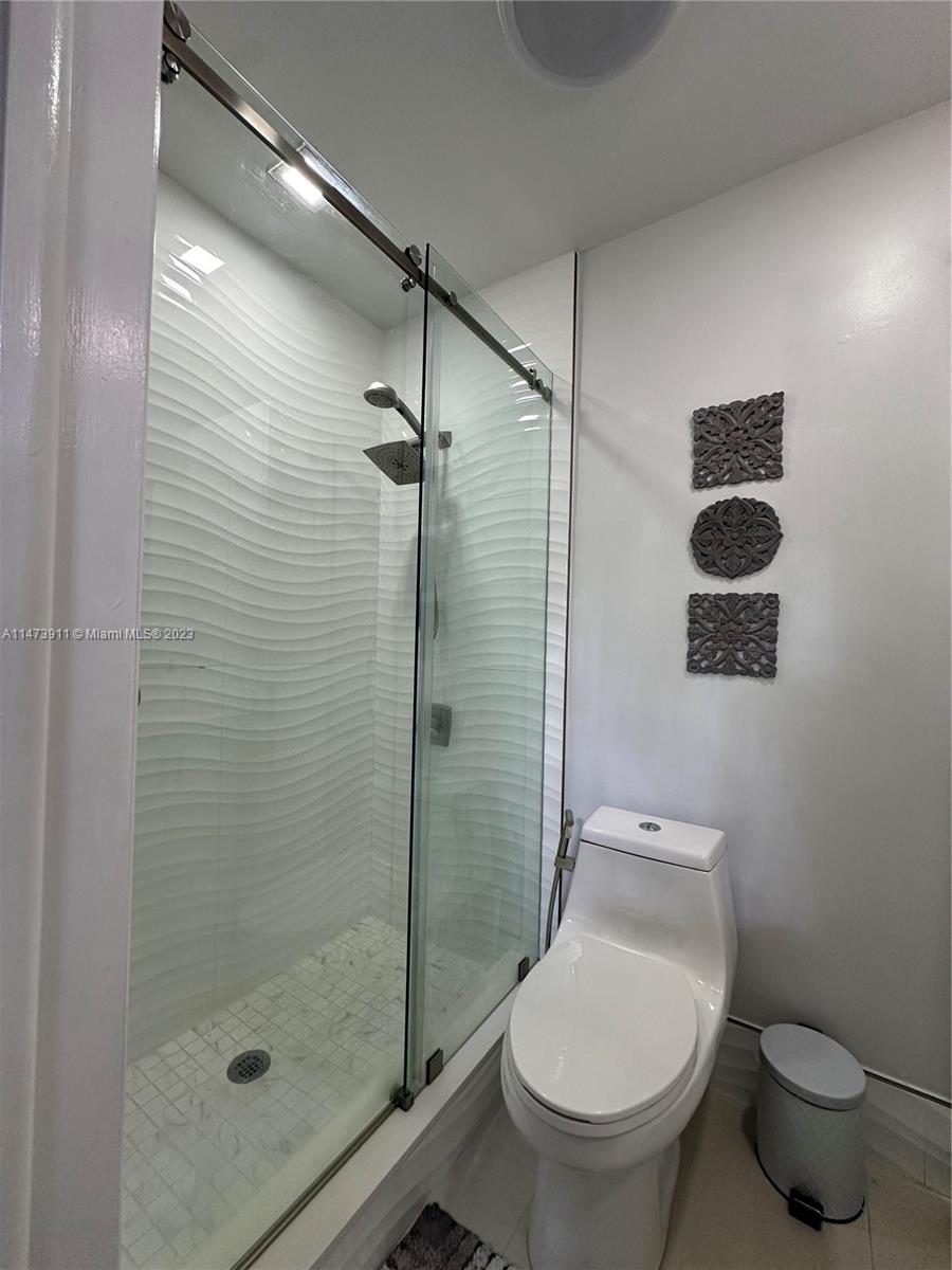 4610 Southwest 89th Place Miami, FL 33165 - Photo 21 of 52 a bathroom with a toilet and a shower