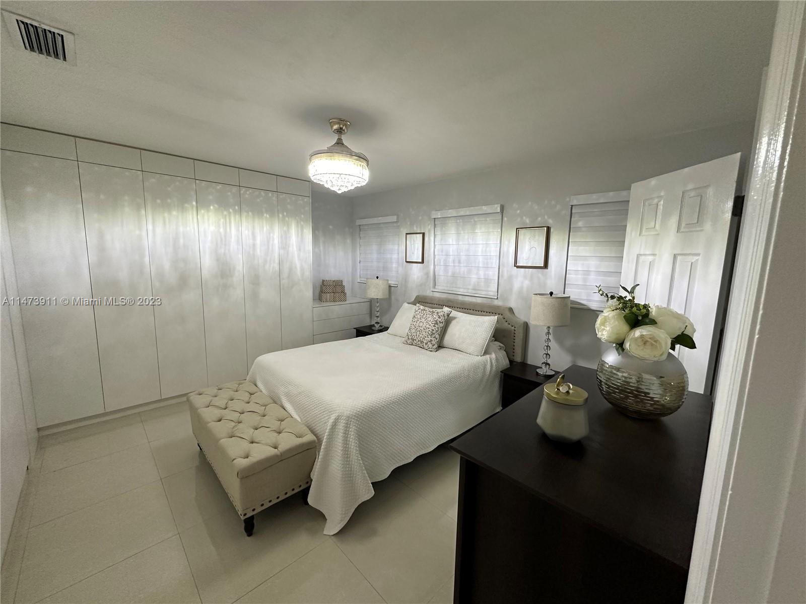 4610 Southwest 89th Place Miami, FL 33165 - Photo 22 of 52 a bathroom with a sink and a mirror