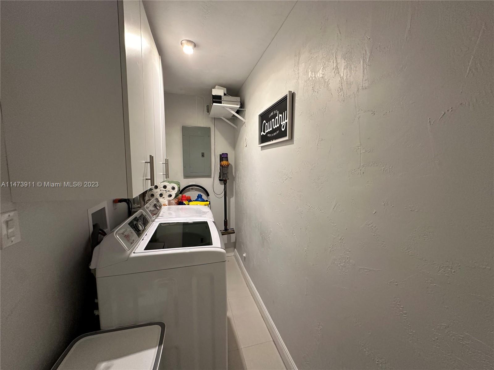 4610 Southwest 89th Place Miami, FL 33165 - Photo 24 of 52 a bathroom with a toilet sink and mirror