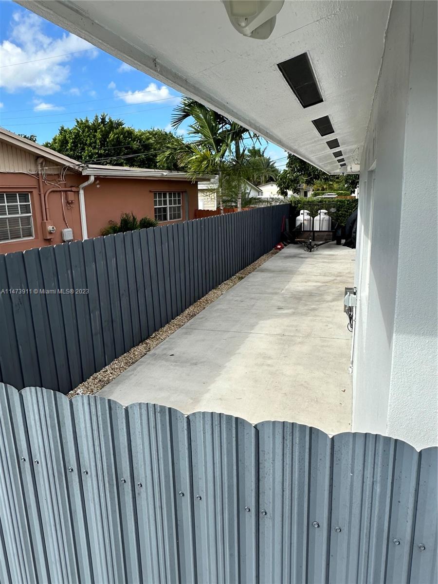 4610 Southwest 89th Place Miami, FL 33165 - Photo 28 of 52 a view of a balcony with wooden floor