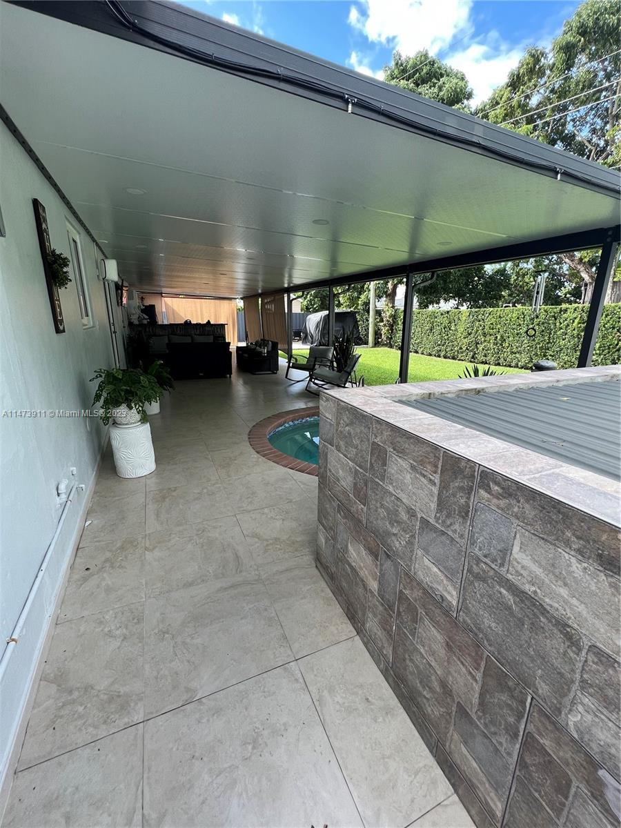 4610 Southwest 89th Place Miami, FL 33165 - Photo 31 of 52 a view of a porch with furniture