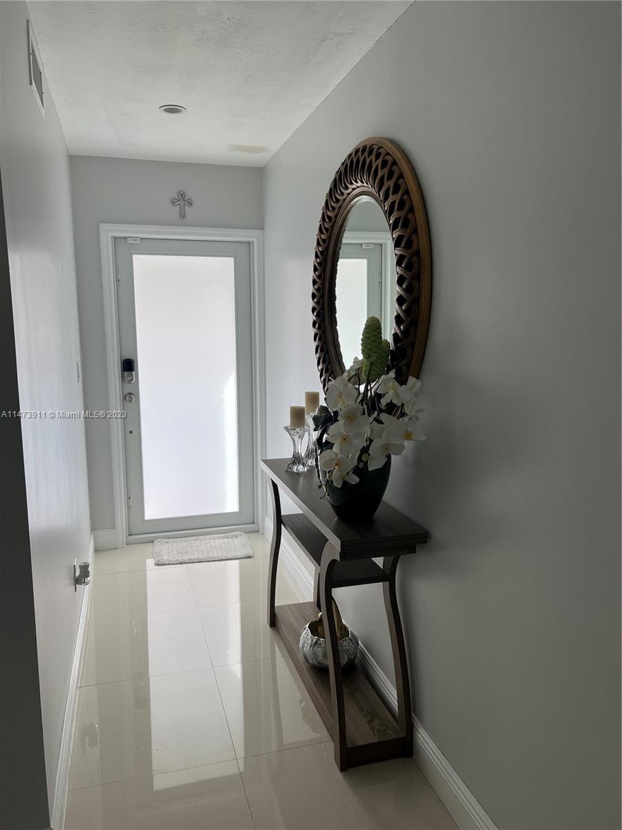 4610 Southwest 89th Place Miami, FL 33165 - Photo 39 of 52 a view of a livingroom with furniture and a window