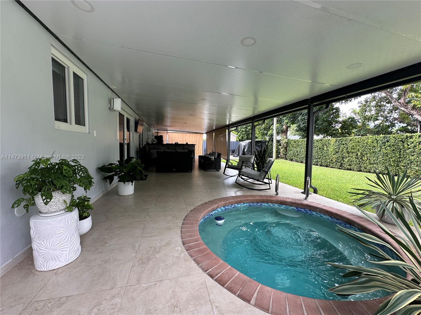 4610 Southwest 89th Place Miami, FL 33165 - Photo 7 of 52 a view of a living room and floor to ceiling window or couch