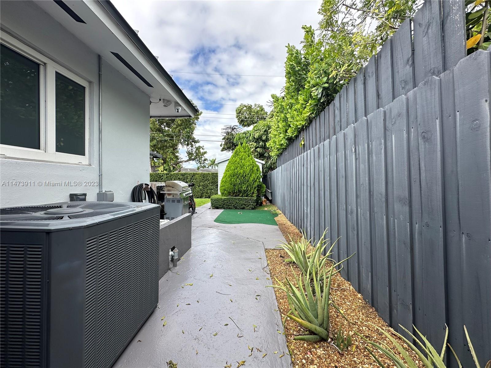 4610 Southwest 89th Place Miami, FL 33165 - Photo 9 of 52 a view of a back yard from a balcony