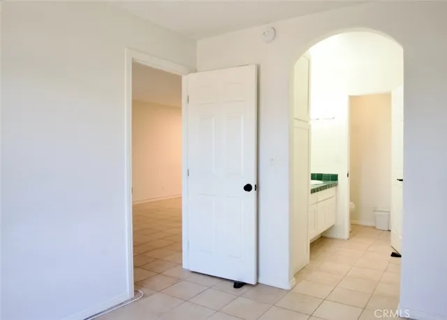 a bathroom with a granite countertop sink and a mirror with toilet