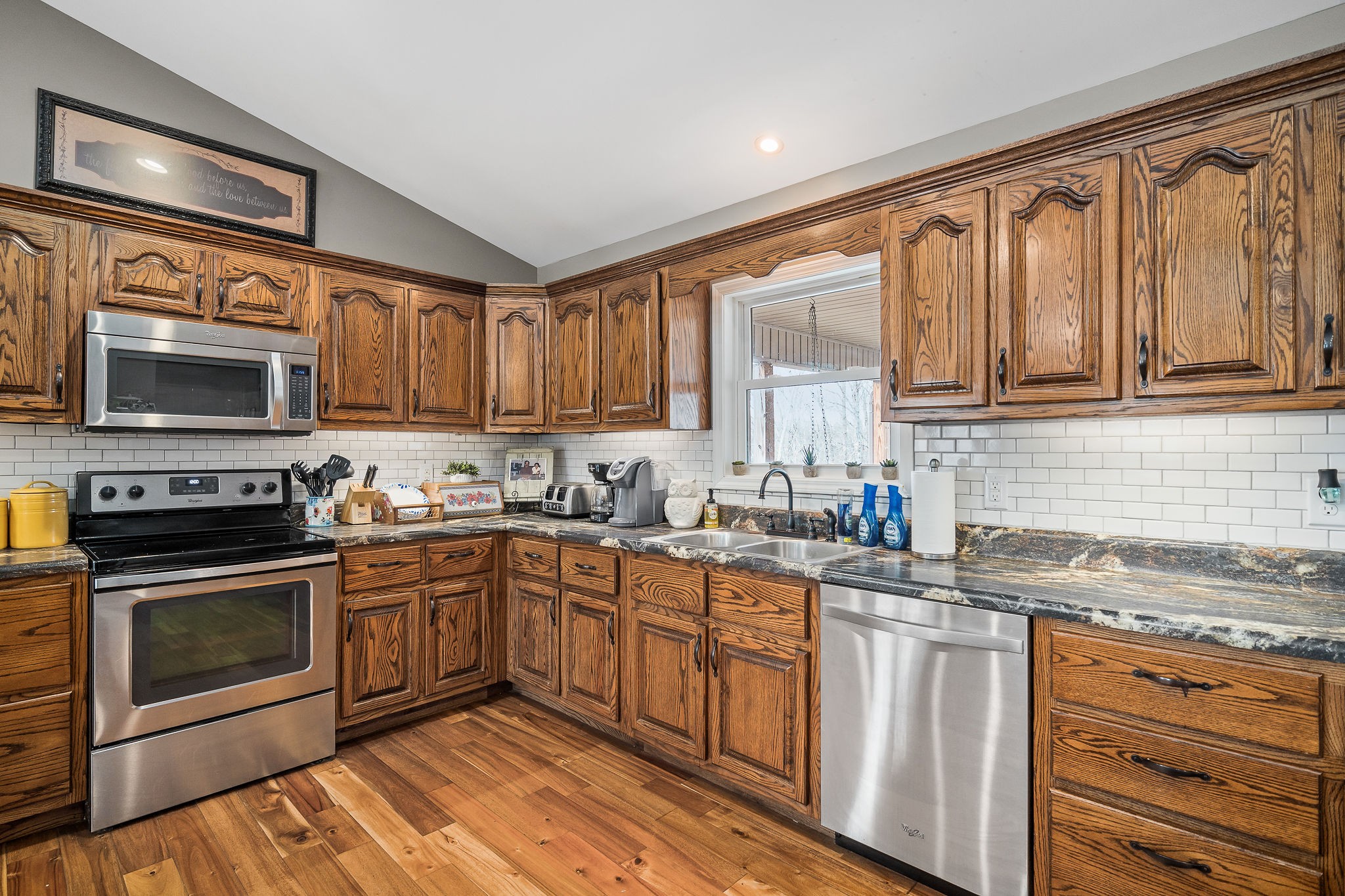 14525 Tucker Ridge Road Silver Point, TN 38582 - Photo 19 of 64 a kitchen with stainless steel appliances granite countertop a stove sink microwave and cabinets