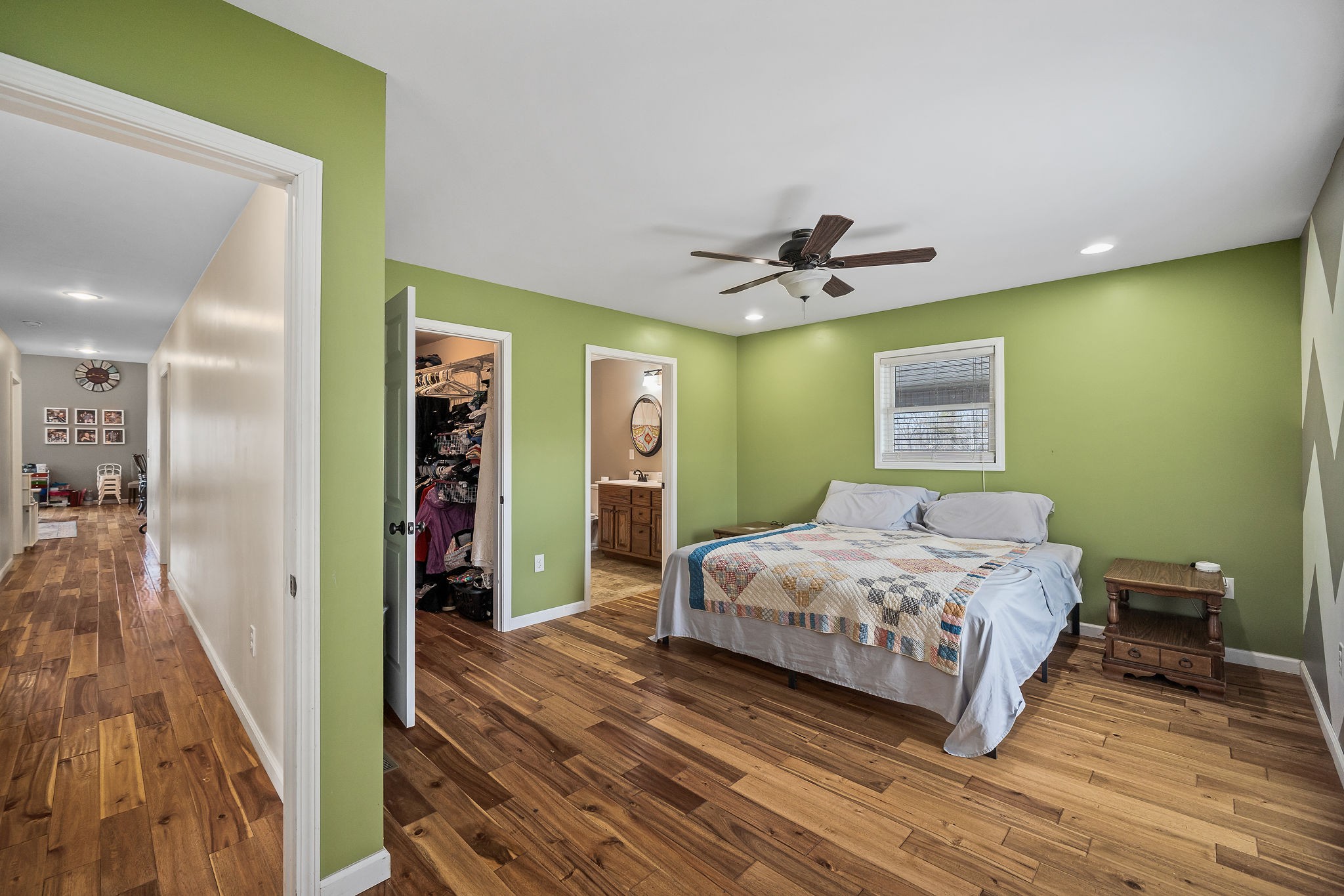 14525 Tucker Ridge Road Silver Point, TN 38582 - Photo 27 of 64 a bedroom with a bed and a chandelier