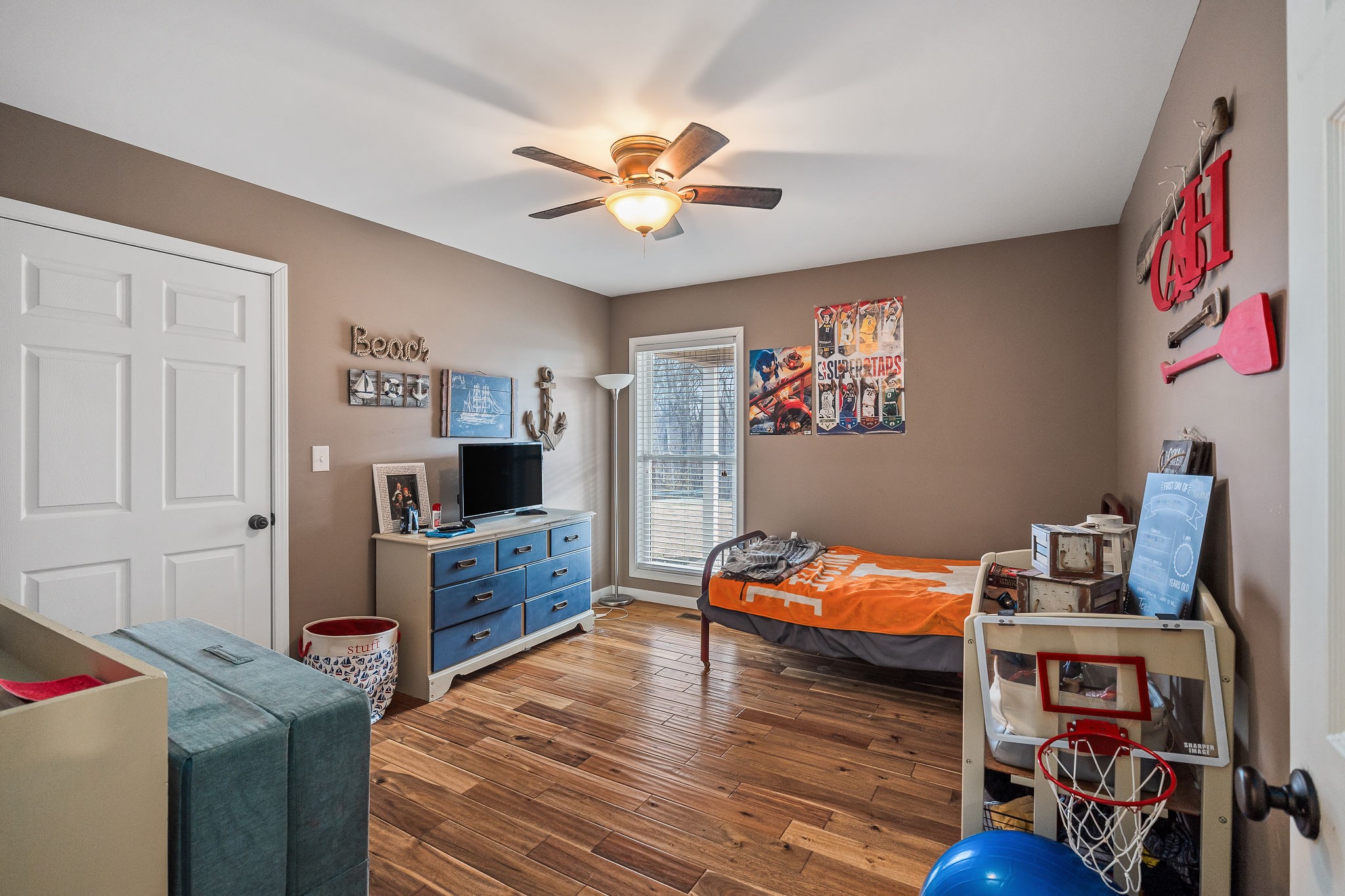14525 Tucker Ridge Road Silver Point, TN 38582 - Photo 33 of 64 a bed room with furniture and a flat screen tv
