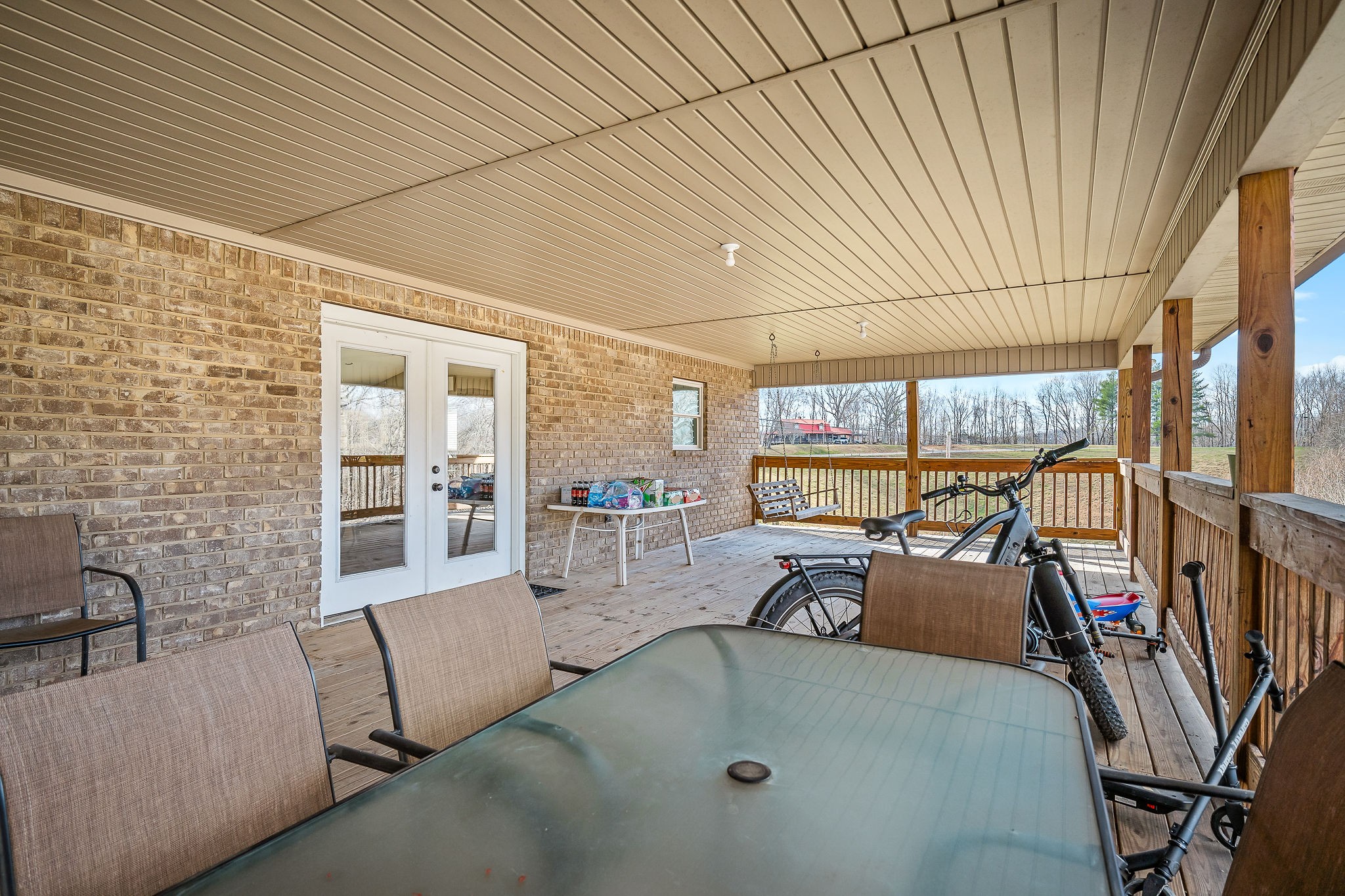 14525 Tucker Ridge Road Silver Point, TN 38582 - Photo 42 of 64 a dining room with furniture and a floor to ceiling window