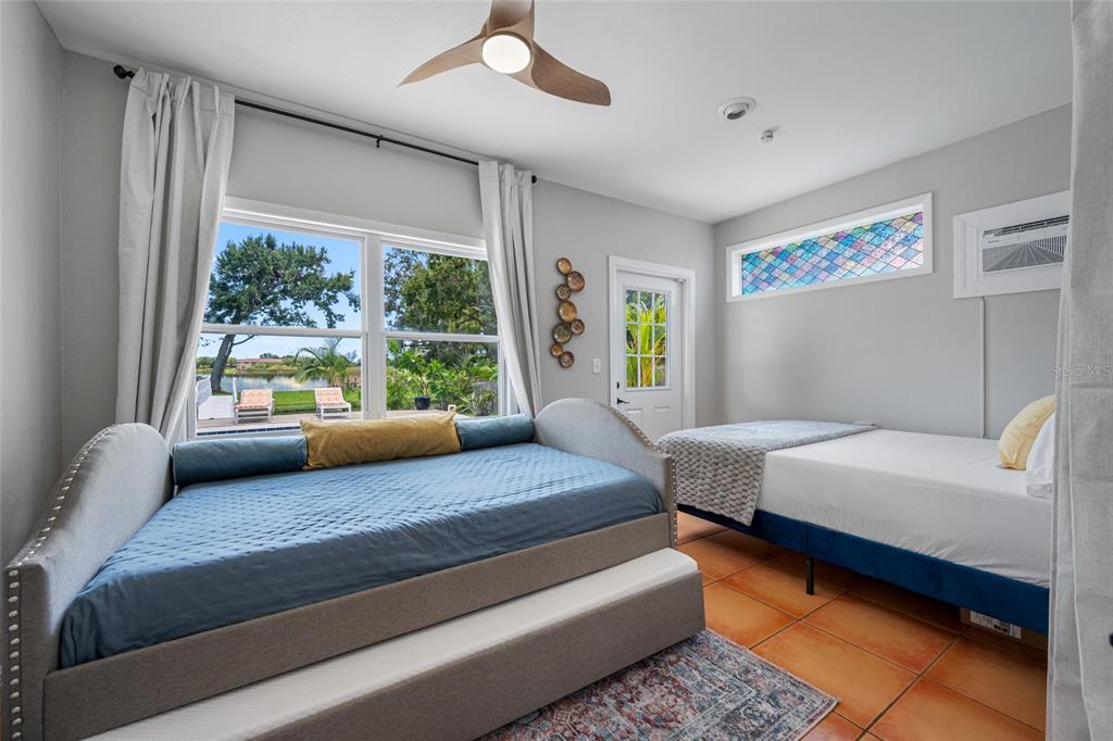 2153 Karan Way Clearwater, FL 33763 - Photo 22 of 65 a bedroom with a bed and a couch