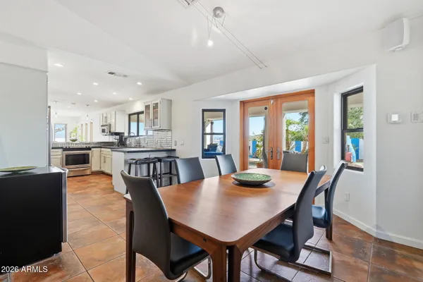 a view of a dining room with a table and chair