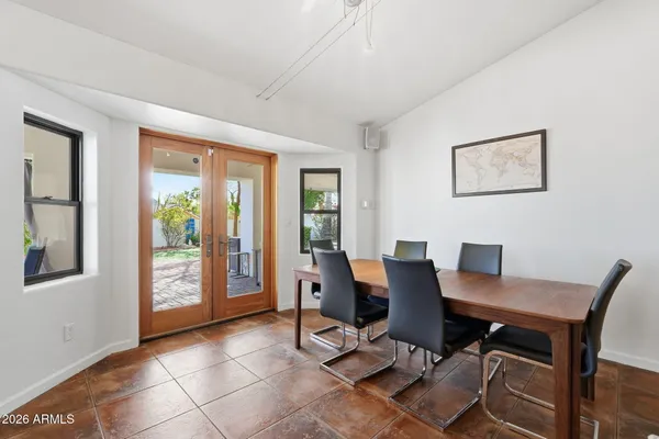 a dining room with furniture and window