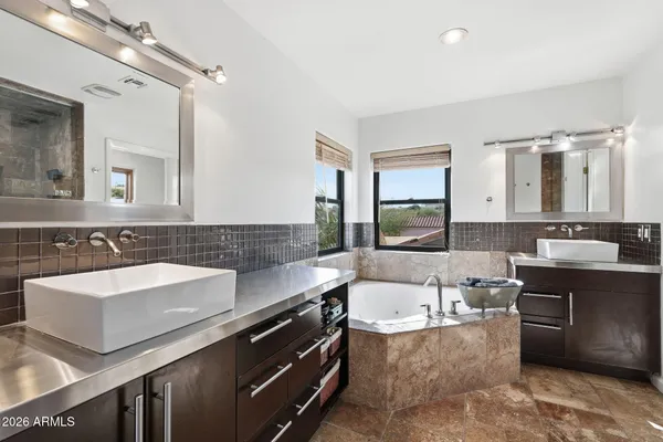 a bathroom with a toilet sink and shower