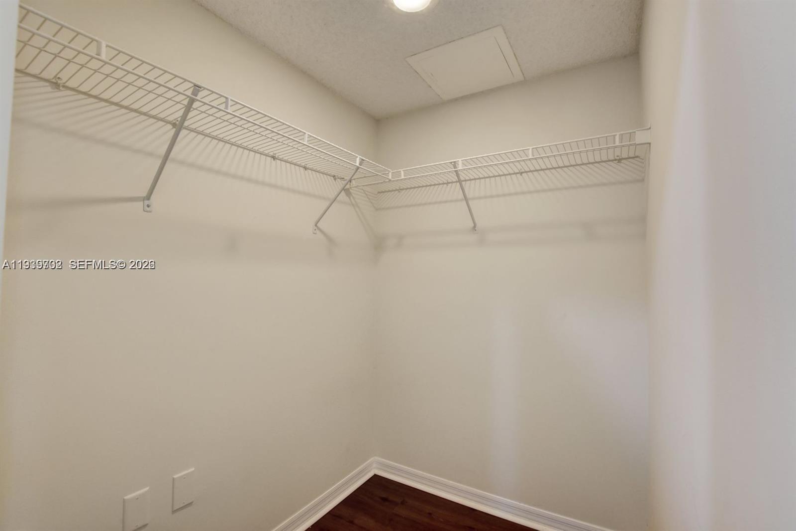 4159 Haverhill Road, Unit 1302 West Palm Beach, FL 33417 - Photo 15 of 19 a view of a room with racks on the wall