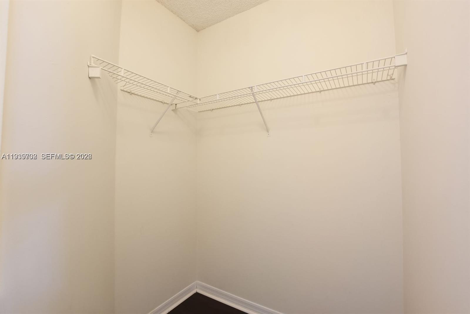 4159 Haverhill Road, Unit 1302 West Palm Beach, FL 33417 - Photo 16 of 19 a view of a room with racks on the wall