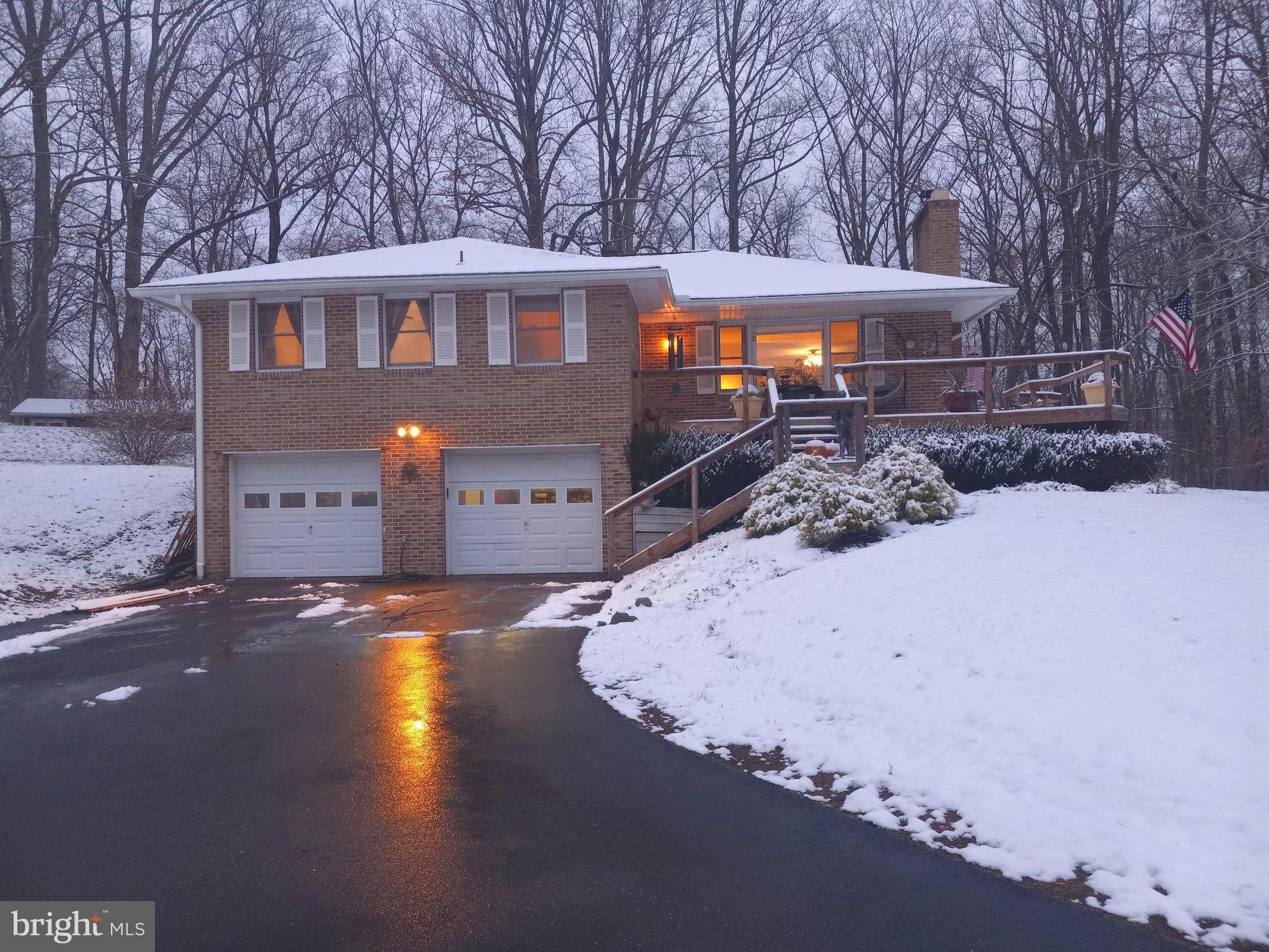 1921 Haven Lane Dunkirk, MD 20754 - Photo 1 of 64 a front view of a house with a yard covered with snow in front of house