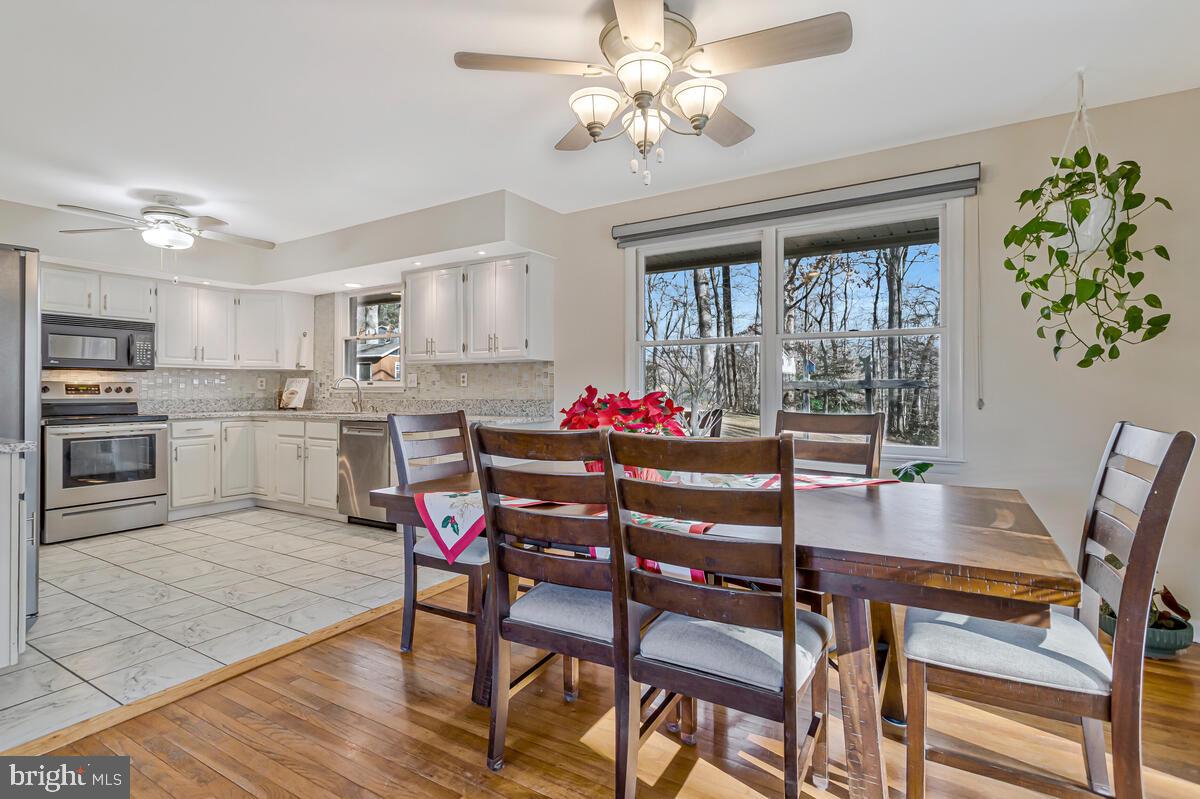 1921 Haven Lane Dunkirk, MD 20754 - Photo 14 of 64 a view of a dining room with furniture window and wooden floor