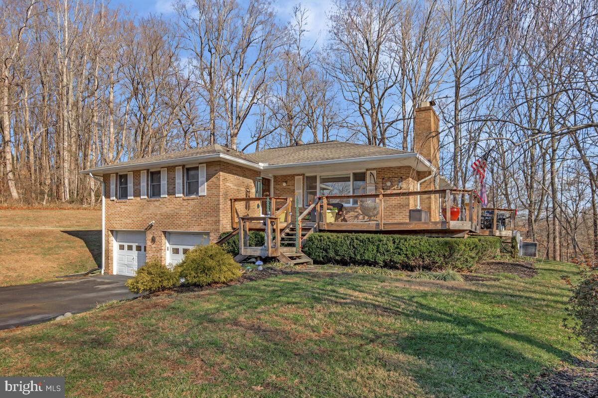 1921 Haven Lane Dunkirk, MD 20754 - Photo 2 of 64 a front view of a house with a garden