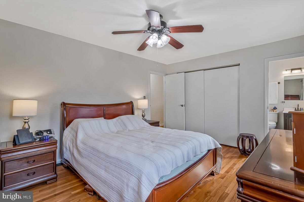 1921 Haven Lane Dunkirk, MD 20754 - Photo 24 of 64 a bedroom with a bed and a chandelier