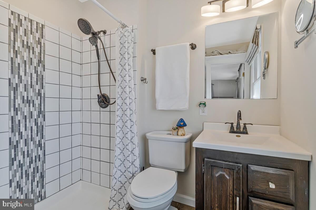 1921 Haven Lane Dunkirk, MD 20754 - Photo 25 of 64 a bathroom with a sink a toilet and shower
