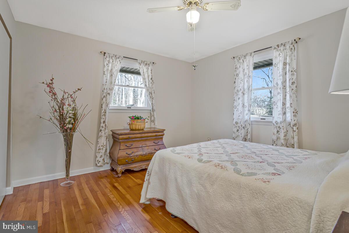 1921 Haven Lane Dunkirk, MD 20754 - Photo 26 of 64 a bedroom with a bed and a chandelier