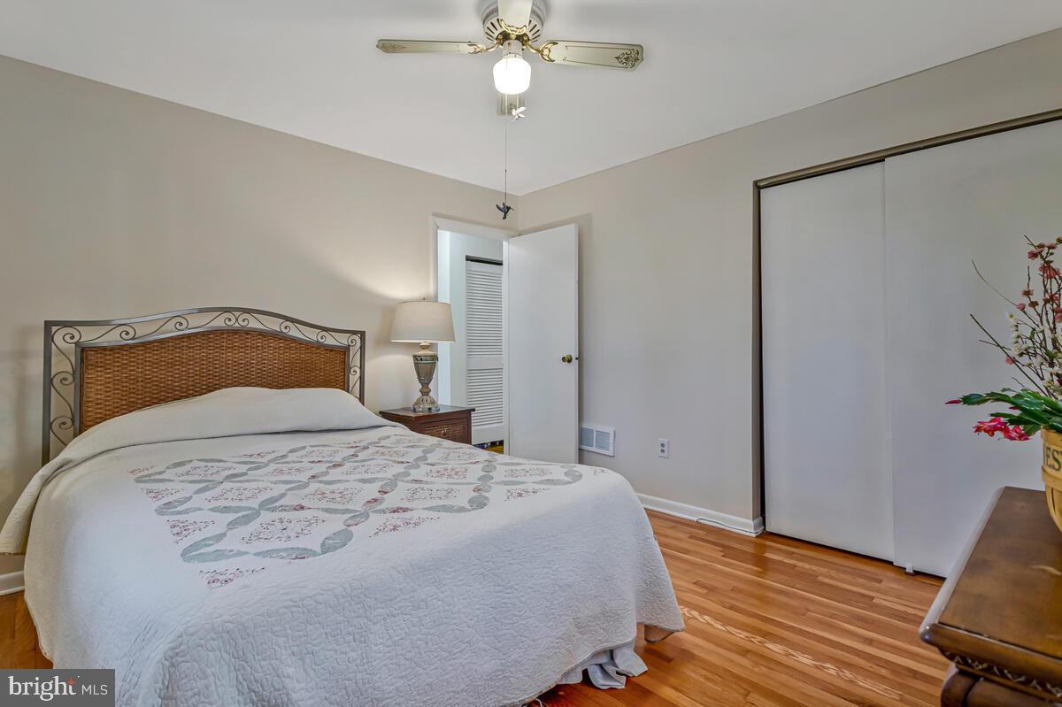 1921 Haven Lane Dunkirk, MD 20754 - Photo 27 of 64 a bedroom with a bed and wooden floor