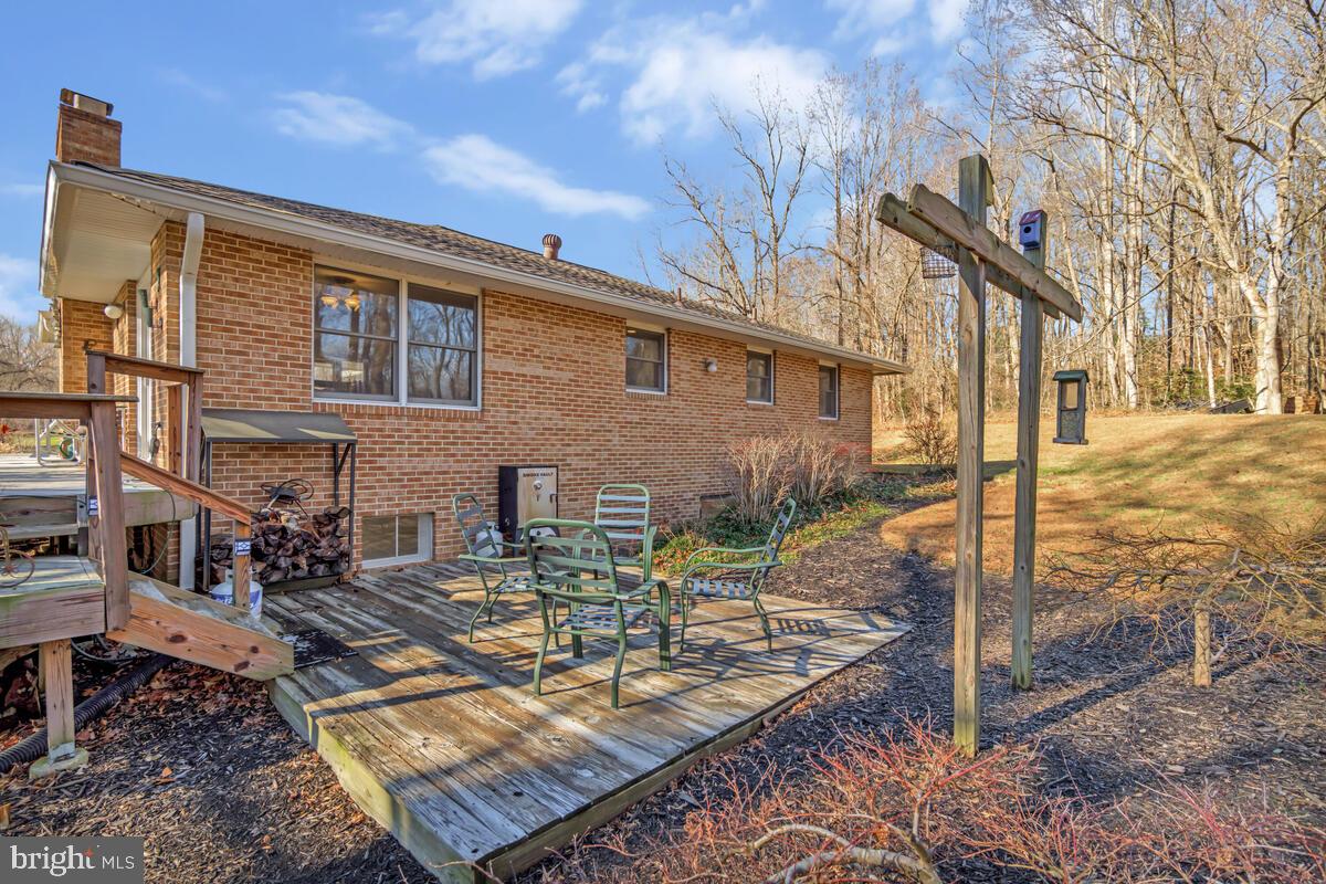 1921 Haven Lane Dunkirk, MD 20754 - Photo 38 of 64 a view of a patio with couches chairs and wooden floor