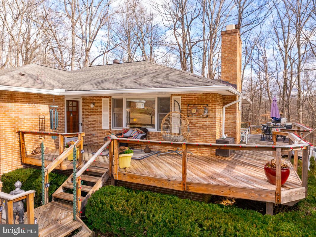 1921 Haven Lane Dunkirk, MD 20754 - Photo 46 of 64 a view of a house with wooden deck and furniture