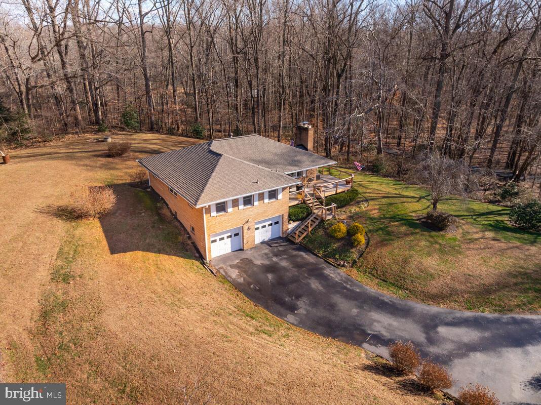 1921 Haven Lane Dunkirk, MD 20754 - Photo 55 of 64 a view of a swimming pool with a yard and large trees