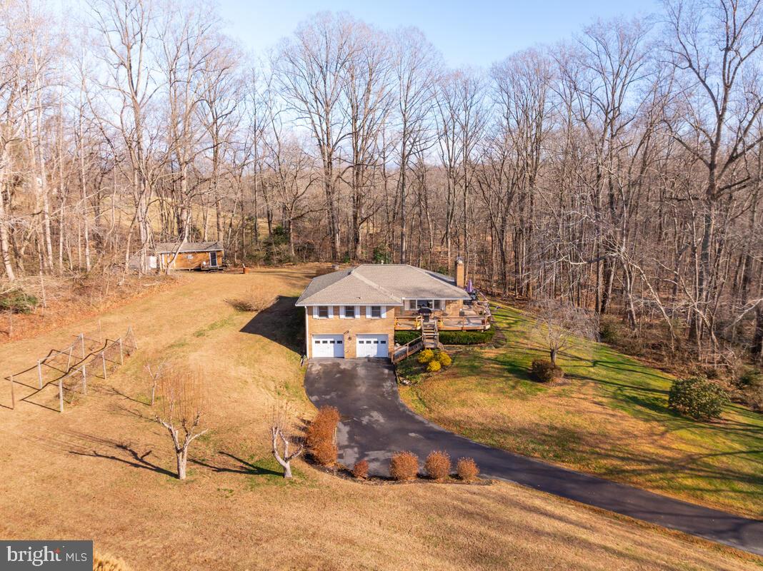 1921 Haven Lane Dunkirk, MD 20754 - Photo 57 of 64 a view of a yard with a table and chairs under an umbrella