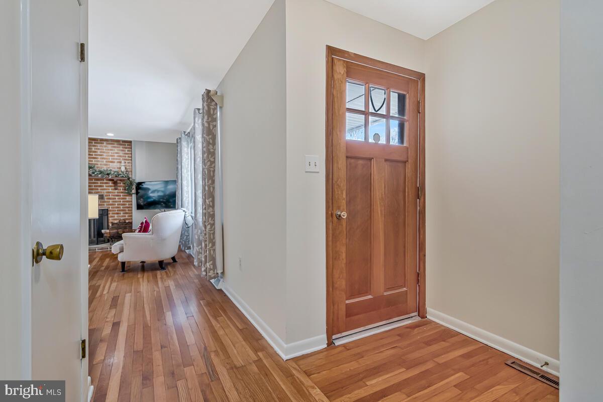 1921 Haven Lane Dunkirk, MD 20754 - Photo 9 of 64 a view of a room that has a bed and wooden floor