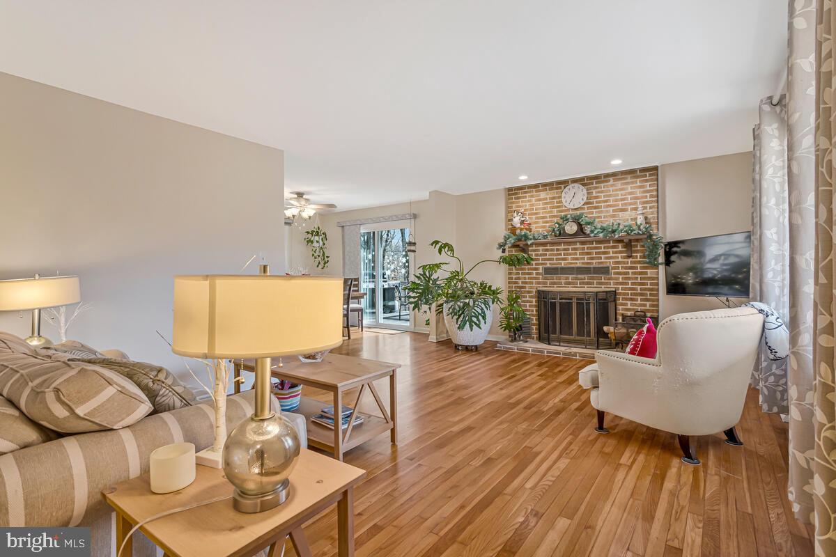 1921 Haven Lane Dunkirk, MD 20754 - Photo 10 of 64 a living room with furniture a fireplace and a flat screen tv