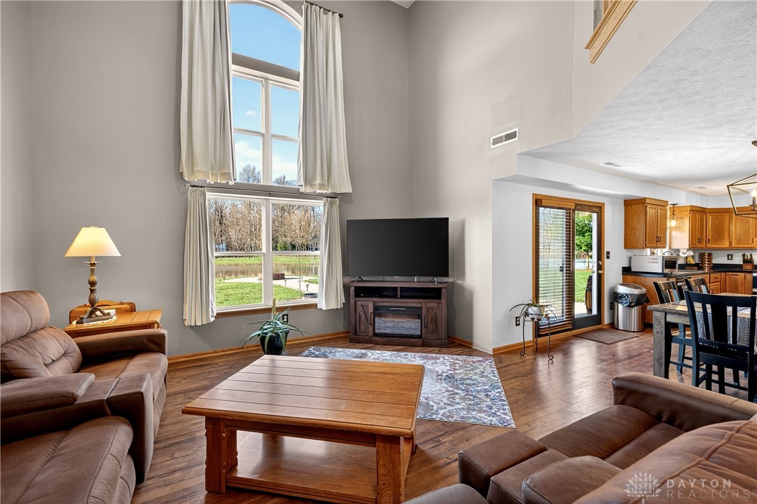 6560 Snyder Road Fletcher, OH 45326 - Photo 14 of 71 This airy living space boasts high ceilings and serene outdoor views, perfect for comfortable living.