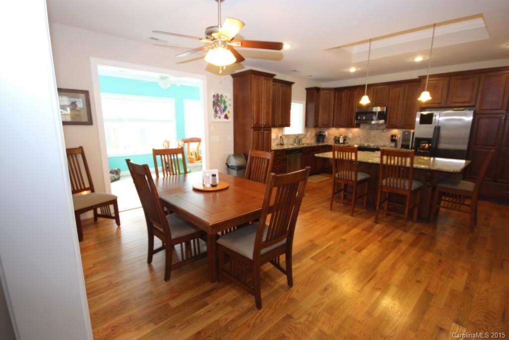 1659 Pine Bluff Court Fort Mill, SC 29708 - Photo 2 of 16 a view of a dining room with furniture window and wooden floor