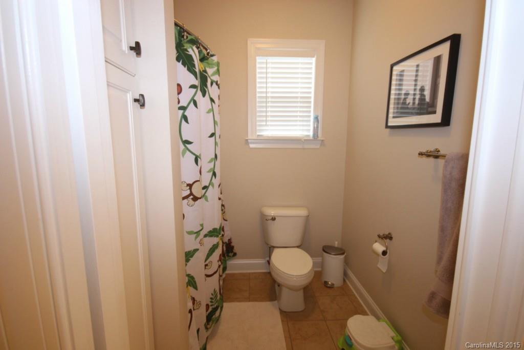 1659 Pine Bluff Court Fort Mill, SC 29708 - Photo 11 of 16 a bathroom with a toilet and a shower curtain