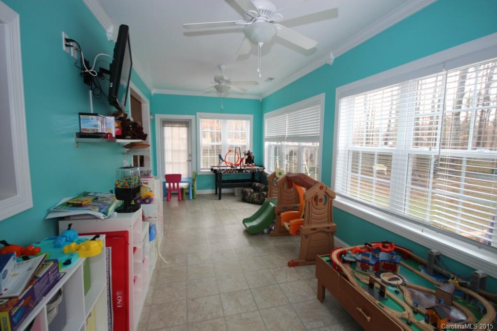 1659 Pine Bluff Court Fort Mill, SC 29708 - Photo 5 of 16 a living room with furniture gym equipment and a large window
