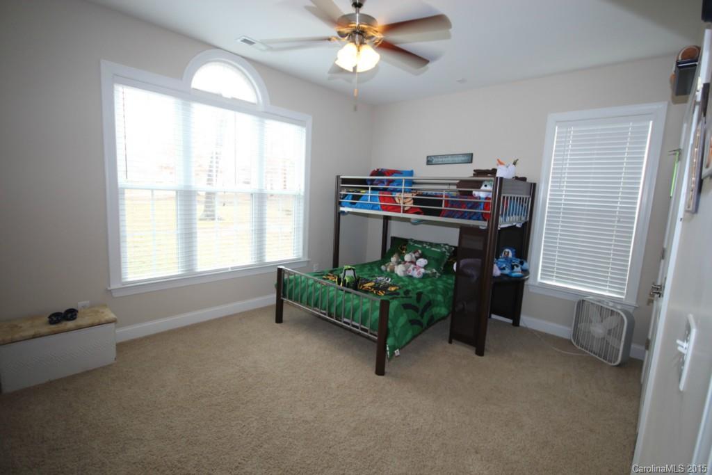 1659 Pine Bluff Court Fort Mill, SC 29708 - Photo 10 of 16 a living room with furniture and a chandelier