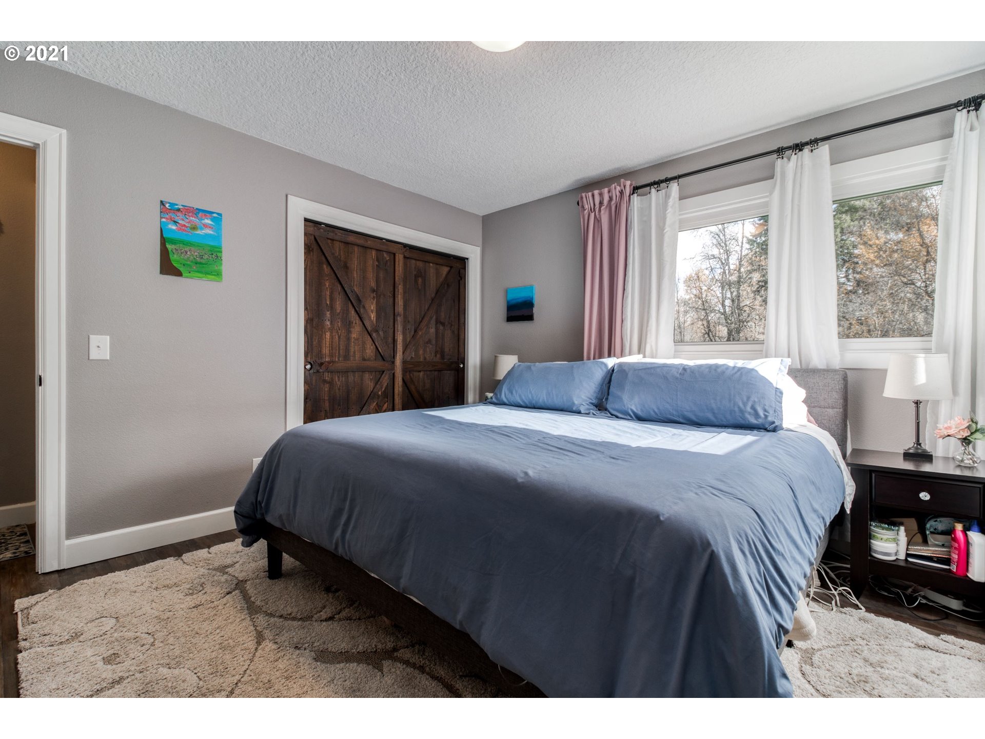 1913 Northeast 199th Street Ridgefield, WA 98642 - Photo 14 of 30 a bedroom with a bed and a window