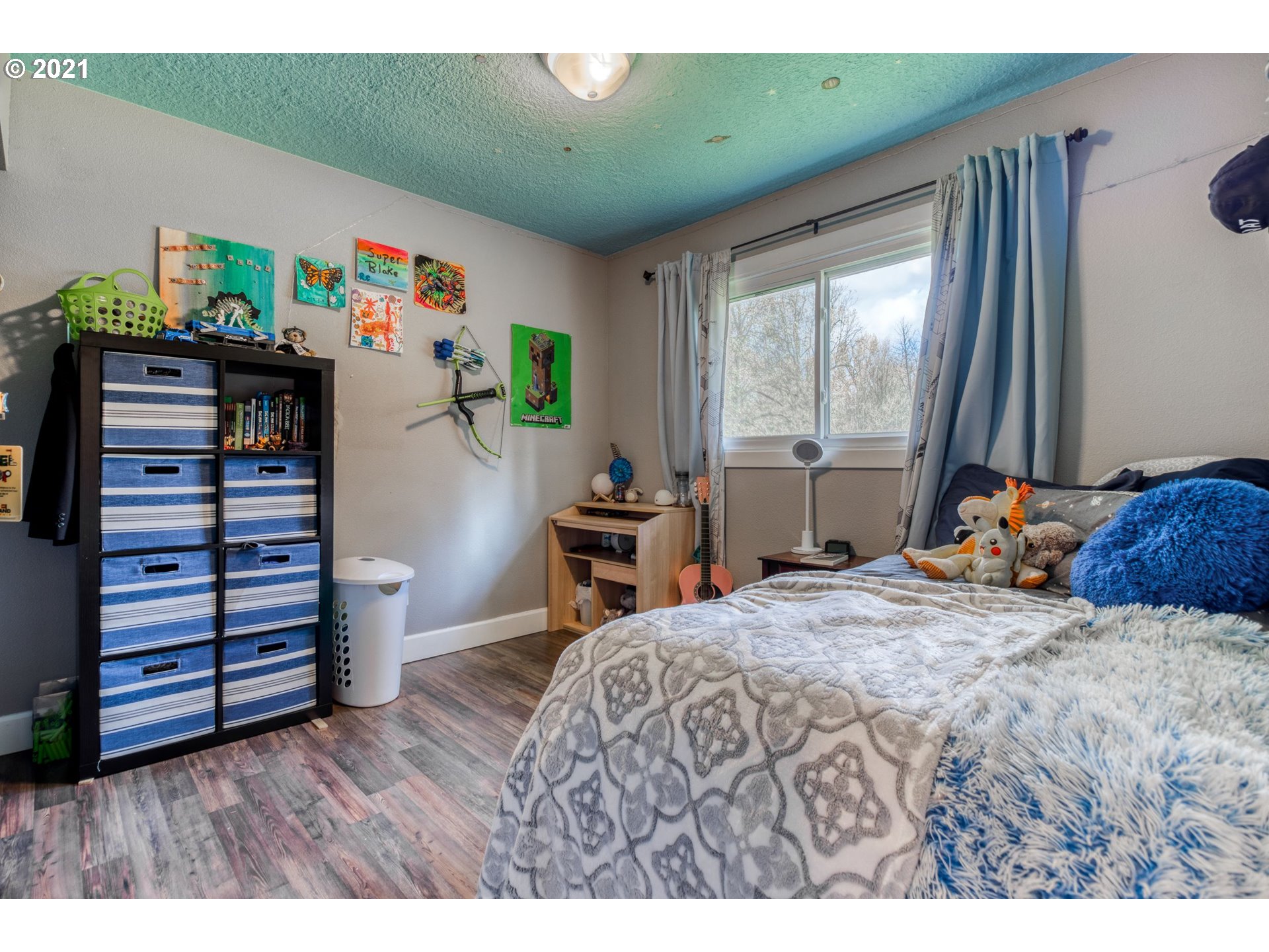 1913 Northeast 199th Street Ridgefield, WA 98642 - Photo 17 of 30 a bedroom with a bed and a desk
