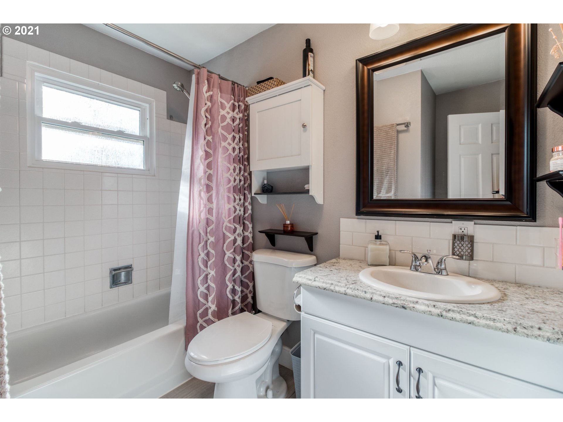 1913 Northeast 199th Street Ridgefield, WA 98642 - Photo 18 of 30 a bathroom with a sink a toilet and shower