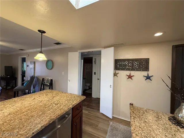 a kitchen with a table and chairs in it