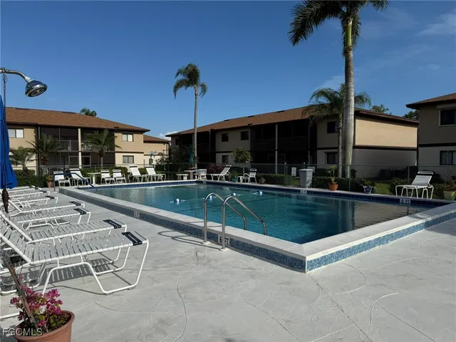 a view of a swimming pool with a patio